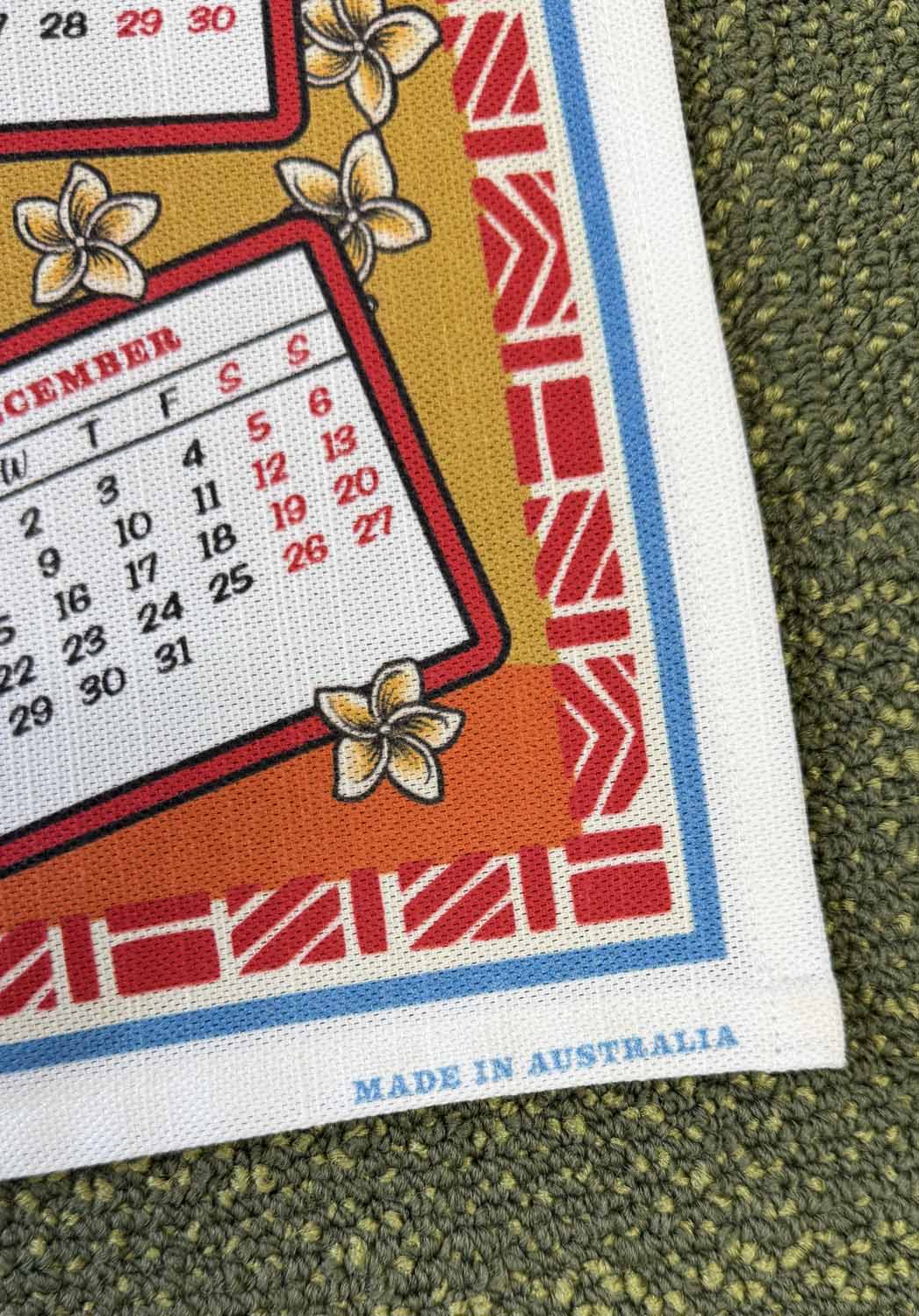 Fabric with a calendar pattern and floral designs, made in Australia.