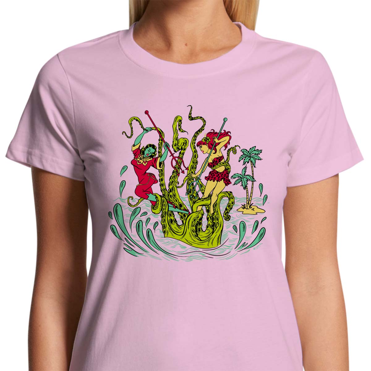 Ladies light pink t-shirt with a vintage tiki style graphic by 50s Vintage Dame showing two pinup women fighting a giant sea creature.