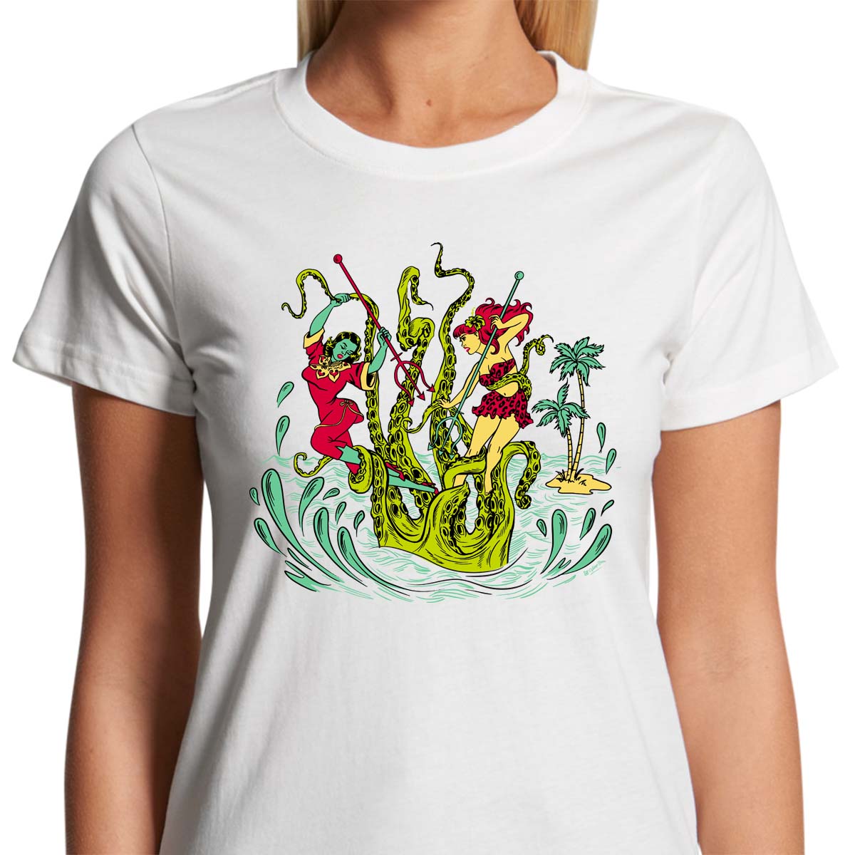 Ladies white t-shirt with a vintage tiki style graphic by 50s Vintage Dame showing two pinup women fighting a giant sea creature.