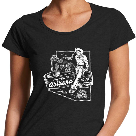 LAdies scoop neck tee shirt with a vintage graphic of a cowboy leaning against a map of Phoenix Arizona