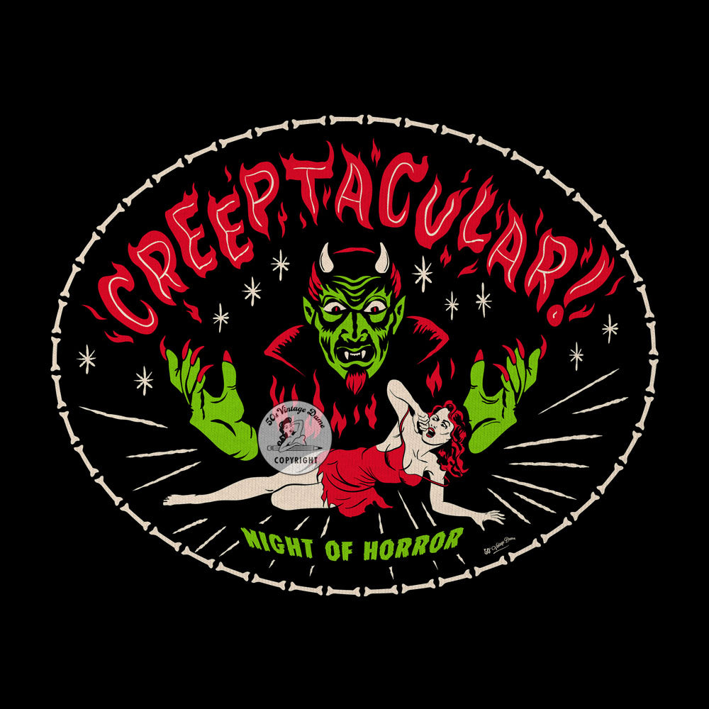 Detail of Creeptacular Haloween graphics from the front of the t-shirt. A creepy devil is terrorising a pinup girl with the text "Creeptacular!" and "Night of Horror!" Similar in style to a B-movie poster from the 1950s.