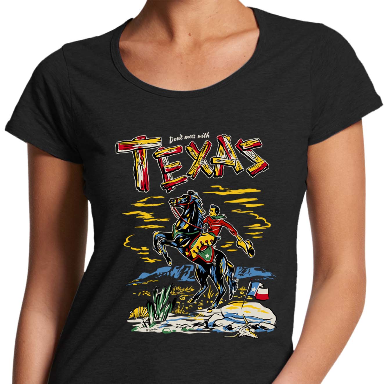 ladies black scoop neck t-shirt with a picture of a cowboy on a horse and the text says "Don't Mess with Texas"