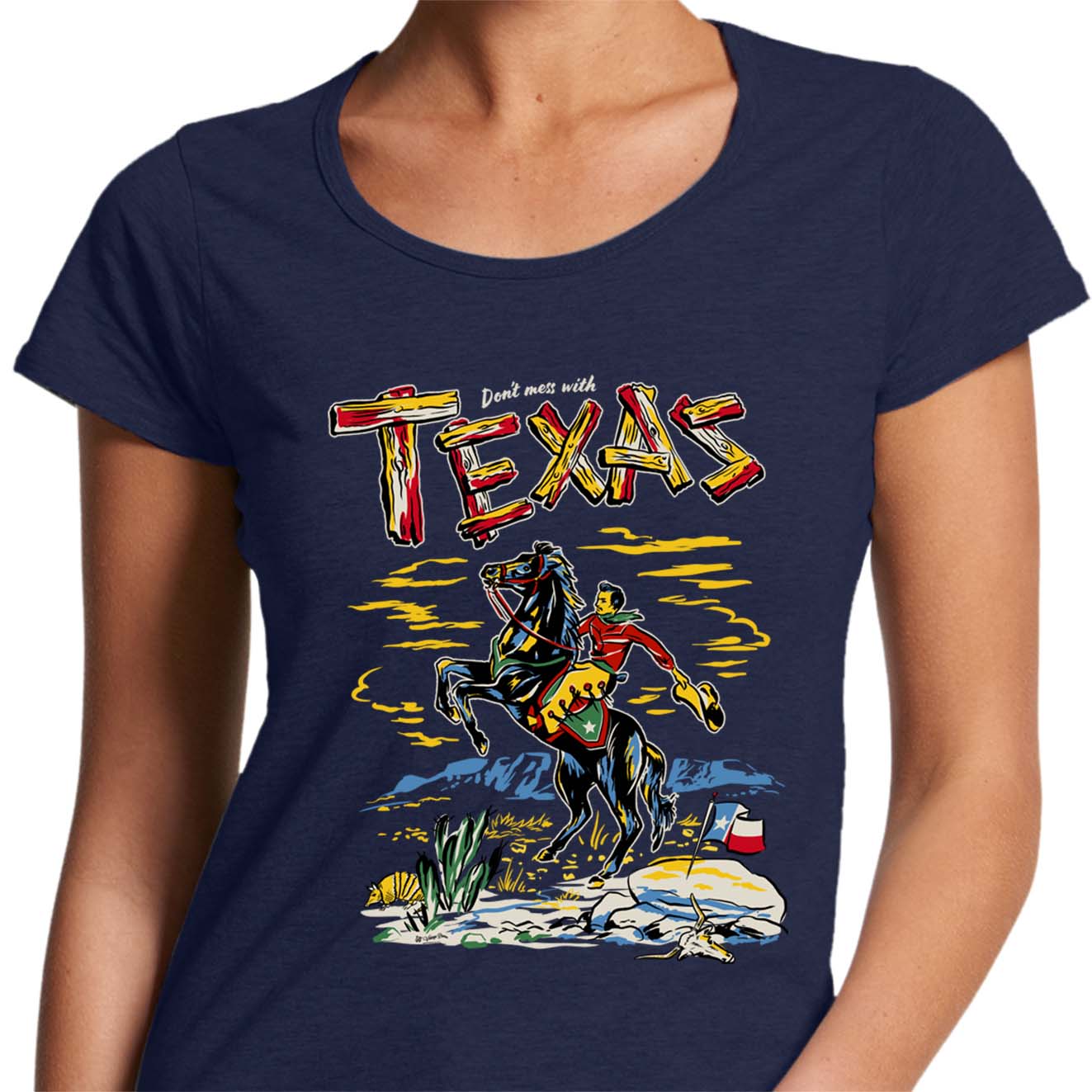 ladies navy blue scoop neck t-shirt with a picture of a cowboy on a horse and the text says "Don't Mess with Texas"