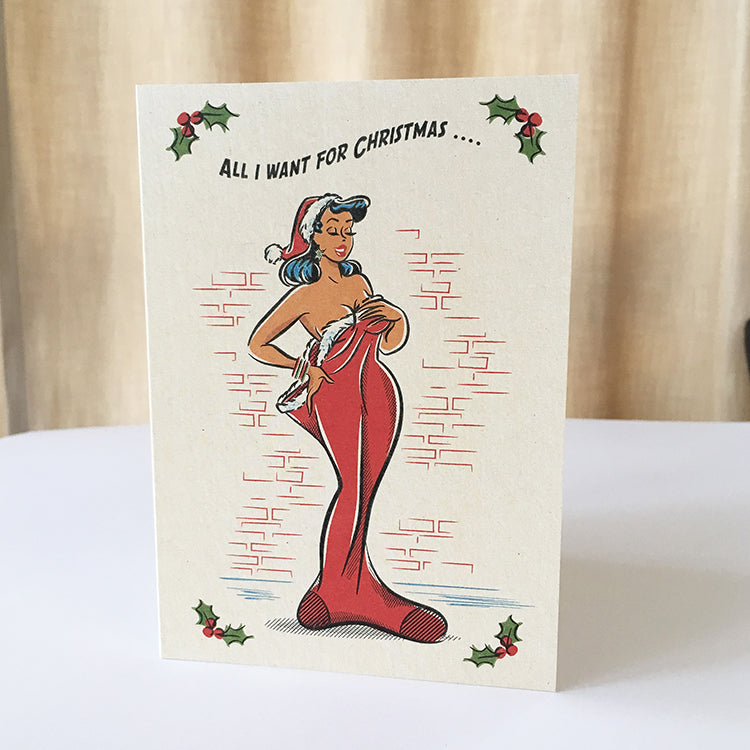 Retro rockabilly Christmas card of a pinup girl illustration in a giant Christmas stocking