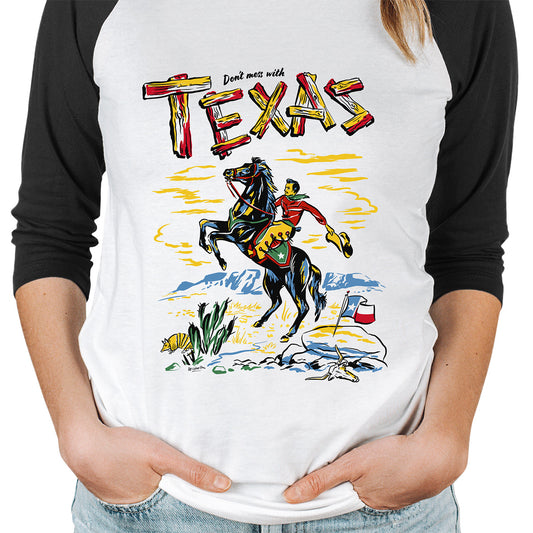 Raglan sleeve t-shirt. Black sleeves and white body. Front image is a vintage style illustration of a cowboy on horseback. Slogan says Don't Mess with Texas.