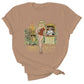 Tan cotton tee shirt with an original illustration featuring a sexy tiki queen pionup lady. Behind her a tiki statue bursts into flames and a sailor behind a little tiki bar spills his drink because he can't take his eyes off her.