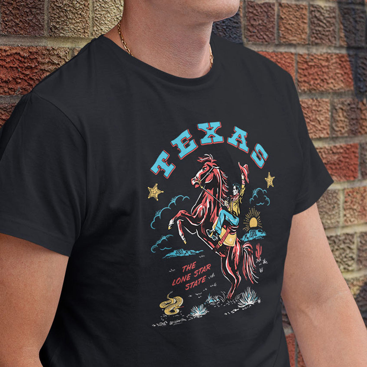 Mens black vintage style tee shirt. Illustration of cowboy on rearing horse